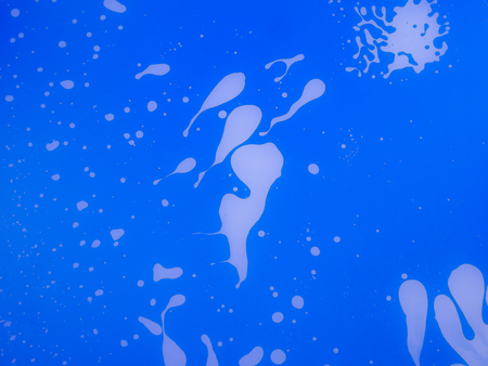 The abstract background with paints on a glass .の写真素材