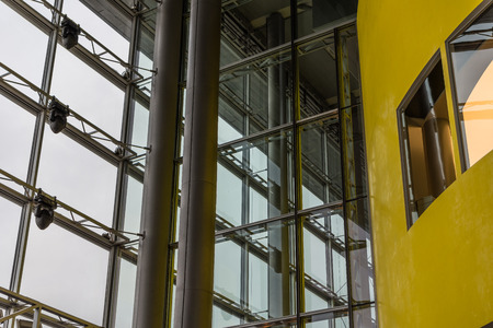 The glass architecture of building against a sky .の写真素材