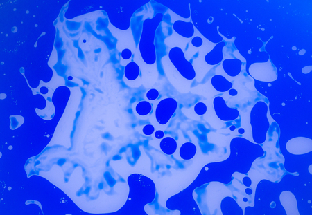 The abstract background with paints on a glass .の写真素材
