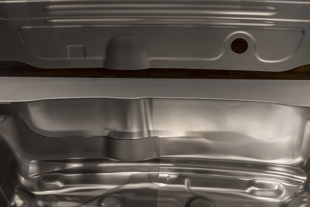 Metal parts of a car in automotive production .の写真素材