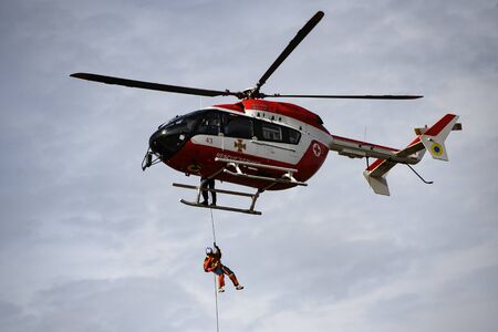 Ukrainian rescuer service helicopter during a rescue operation on fire. Training of rescue services...