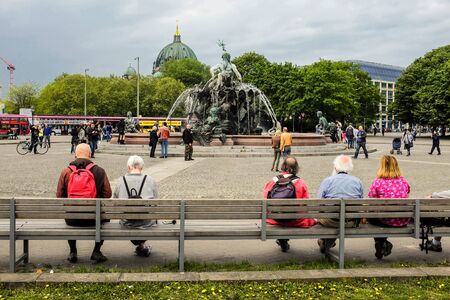 People rest near Neptune Fountain Neptunbrunnen in Berlin, Germany. May 2014のeditorial素材
