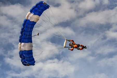 Ukrainian rescuer goes down with parachute during the tactical-special drills of the Ministry of Internal Affairs on the shooting range in the village of Stare, Ukraine, September 2019.のeditorial素材