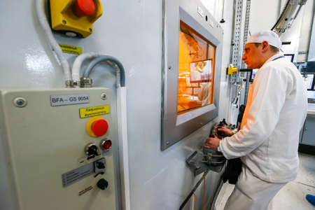 Worker operating in factory for treatment of hard radioactive waste at Chernobyl nuclear power...