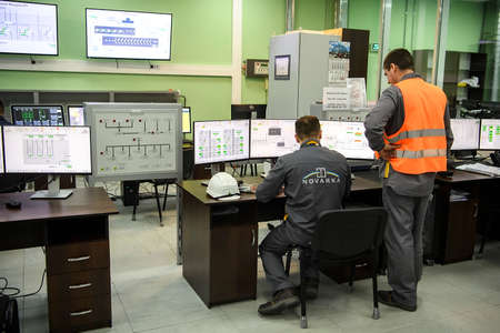 Worker operates in control center of new Safe Confinement covering 4th block of Chernobyl Nuclear power plant. Ukraine.のeditorial素材