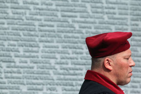 Catholic priests near Memorial wall with the names of Poles, victims of Stalinist repressions at the...