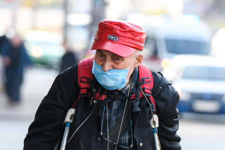 Elderly man wearing protective mask as a preventive measure against coronavirus COVID-19 in Kyiv, Ukraine.のeditorial素材