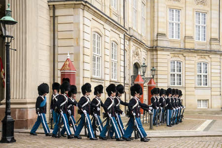 Royal Guard during Honor Guard Change Ceremony at Royal Amalienborg Palace in Copenhagen, Denmark.