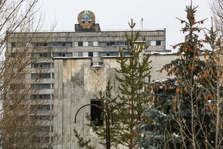 Soviet coat of arms on building in abandoned city of Prypiat, near Chornobyl nuclear power plant, Ukraineの写真素材