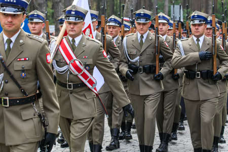 Servicemen of honor guard of Polish army during ceremonial events at Polish military cemetery Polish...