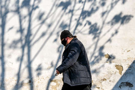 Orthodox monk in protective mask against the coronavirus COVID 19 walks near Pechersk Lavra . Kyiv, Ukraine.のeditorial素材