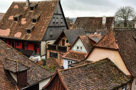 View from town wall of facades and roofs of medieval old town Rothenburg ob der Tauber, Bavaria, Germany.の写真素材