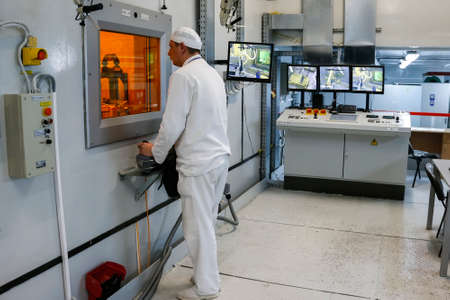 Worker operating in factory for treatment of hard radioactive waste at Chernobyl nuclear power...