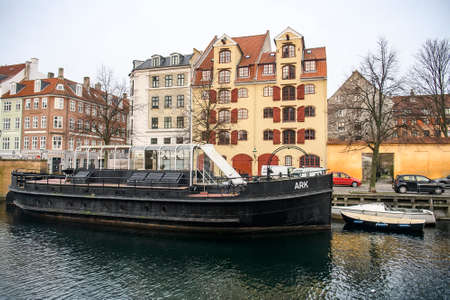 Boats and yachts on canal between Overgaden Oven Vandet and Overgaden Neden Vandet in Copenhagen, Denmark. の写真素材