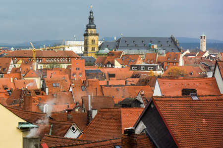 View of traditional houses with typical red tiled rooftops in Bamberg, Bavaria, Franconia, Germany. November 2014. High quality photoの写真素材