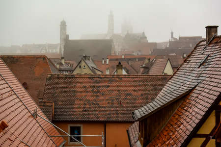 View from town wall of facades and roofs of medieval old town Rothenburg ob der Tauber, Bavaria, Germany.の写真素材