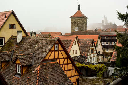 View from town wall of facades and roofs of medieval old town Rothenburg ob der Tauber, Bavaria, Germany.の写真素材