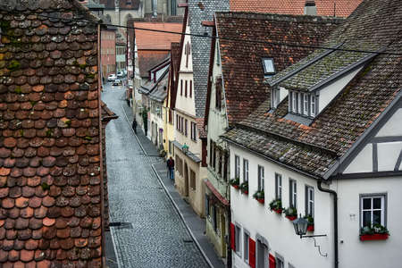 View from town wall of facades and roofs of medieval old town Rothenburg ob der Tauber, Bavaria, Germany.の写真素材