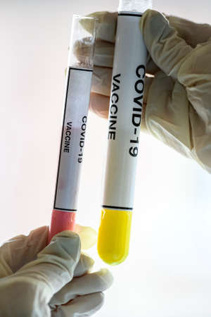 Test tubes with samples of the vaccine against the coronavirus COVID - 19 2019-nCoV. Concept photo. High quality photoの写真素材