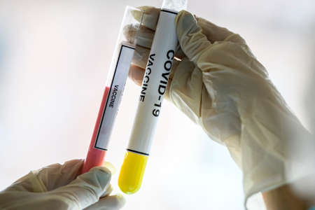Test tubes with samples of the vaccine against the coronavirus COVID - 19 2019-nCoV. Concept photo. High quality photoの写真素材