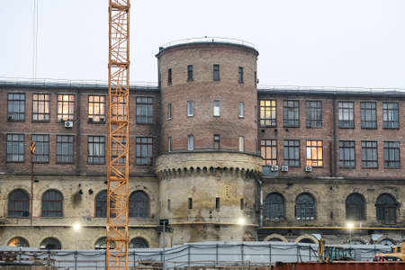 Western facade with towers of the old historic building of the Arsenal plant in center of Kyiv,...