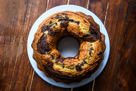 Homemade chocolat-orange cake on a dark wood background. High quality photoの写真素材