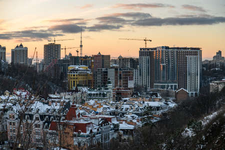 Evening winter view to Vozdvyzhenska street, new district on ancient historical area in Podil district of the Kyiv city, Ukraine. High quality photoの写真素材