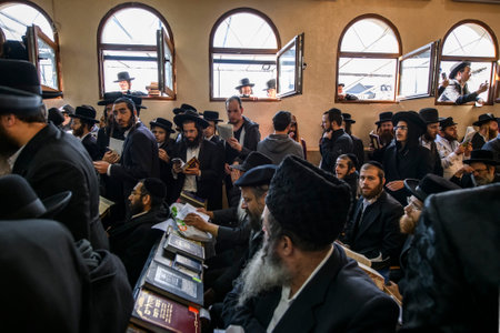 Ultra-Orthodox Jewish pilgrims pray at the tomb of Rabbi Nachman of Breslov during the celebration of Rosh Hashanah holiday, the Jewish New Year, in Uman, Ukraine September 25, 2022のeditorial素材