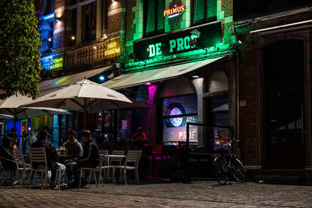 Leuven, Flemish Brabant Region, Belgium - 09 22 2021: Student having a party at the Old Market square with cafe de Prof, a student barのeditorial素材