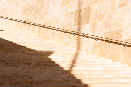 Yellow stairs in nature stone: detail with hard sunlight and shadow in Valletta, Maltaの写真素材