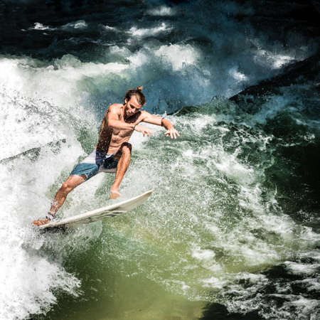 Munich, Bavaria - Germany - 07 29 2018: Locals surfing on the Isar river in summerのeditorial素材
