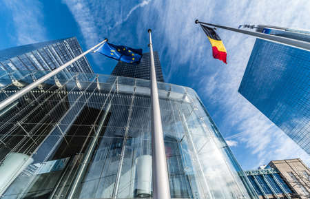 Brussels, Belgium - 03 10 2019: the contemporary North Galaxy tower with the Federal government offices and a Belgian and European flag in the business Little Manhattan districtのeditorial素材