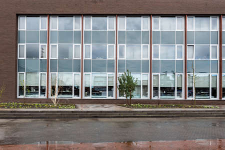 Echt, Limburg, The Netherlands, 04 07 2022 - Rectangular windows of the contemporary building of the town hallのeditorial素材