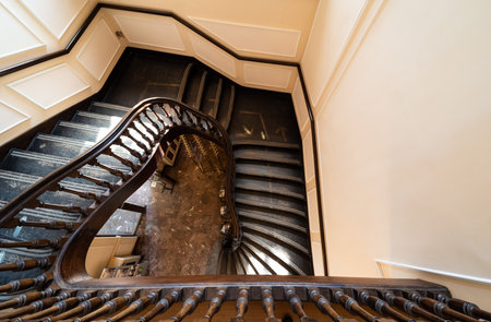 Meise, Flanders - Belgium - 02 09 2021 Swirling staircase in antique wooden styleのeditorial素材