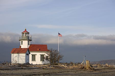 Point Robinson light and flag pole on Vashon Island Washingtonの写真素材