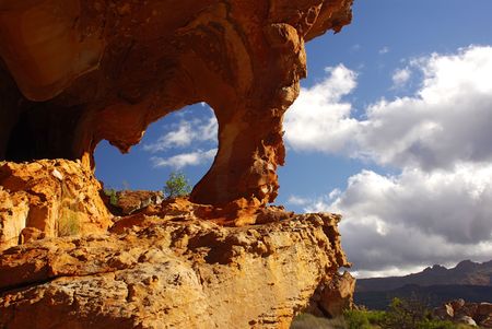 Yellow red stones and cliffs with arc on red soil. mountains of South Africa の写真素材