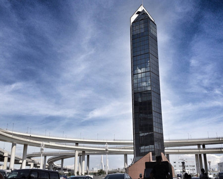 A famous landmark in Japan. The building with a huge parking lot is in the middle of a complex...