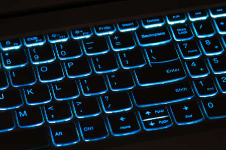Illuminated blue computer keyboard - laptop, notebookの写真素材