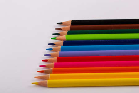 Stacked colored pencils on a light background. Side view.の写真素材
