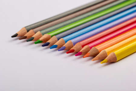 Stacked colored pencils on a light background. Side view.の写真素材