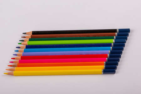 Stacked colored pencils on a light background. Side view.の写真素材
