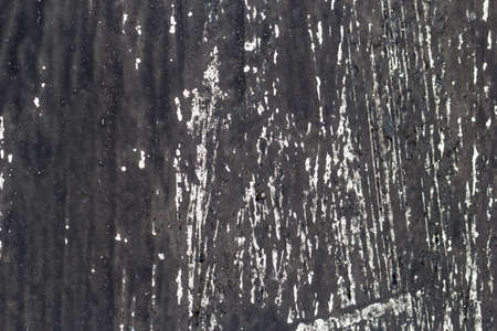 Dark scratched metal. Dark metal background. Empty space.の写真素材