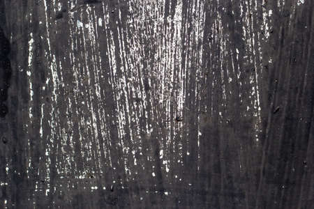 Dark scratched metal. Dark metal background. Empty space.の写真素材