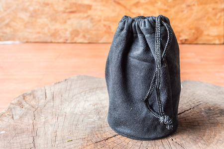 black camera lens bag on woodの写真素材