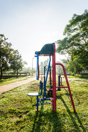 Exercise equipment in public park on sunrise.の写真素材