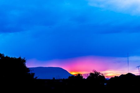 sunrise above roof of house in rural scene (silhouette) at Chiyaphum,Thailand
