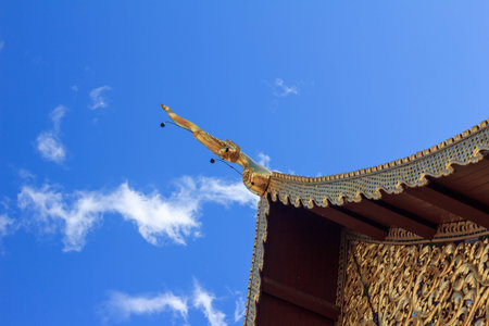 Temple golden crest and blue sky