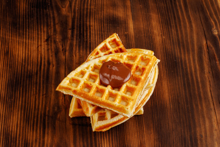 Homemade waffles on a wooden backgroundの写真素材