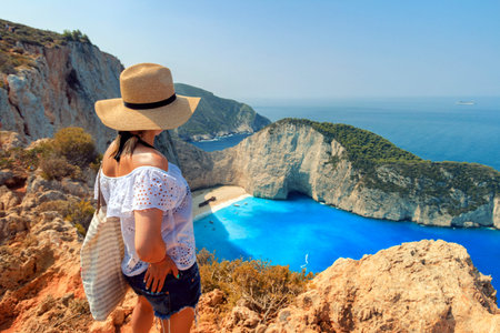 Woman looking at Zakynthos beach of Zante