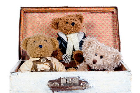 Old toy teddy bears in wooden caseの写真素材